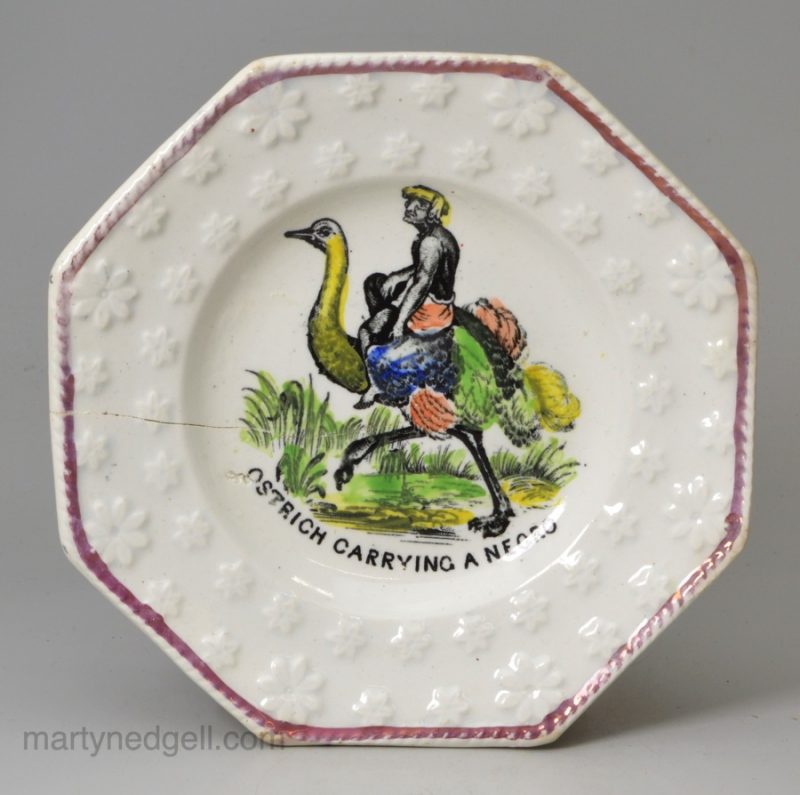 Pearlware pottery child's plate 'OSTRICH CARRYING A NEGRO', circa 1830