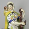 Large Staffordshire pearlware pottery figure of the Widow and orphans, circa 1820