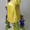 Large Staffordshire pearlware pottery figure of the Widow and orphans, circa 1820