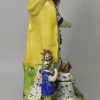 Large Staffordshire pearlware pottery figure of the Widow and orphans, circa 1820