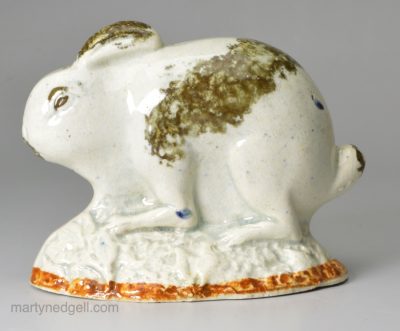 Pearlware pottery rabbit decorated with colours under the glaze, circa 1790