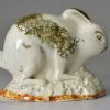 Pearlware pottery rabbit decorated with colours under the glaze, circa 1790