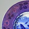 Pearlware pottery cup plate decorated with blue transfer and pink lustre border, circa 1820