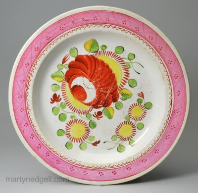 Pearlware pottery plate decorated with overglaze enamels, circa 1820