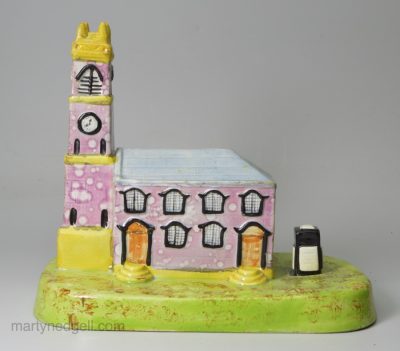 Pearlware pottery model of a church decorated with overglaze enamels and pink splash lustre, circa 1820