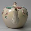 Staffordshire saltglaze teapot decorated with sprigs and enamels, circa 1760