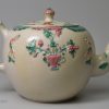 Staffordshire saltglaze teapot decorated with sprigs and enamels, circa 1760