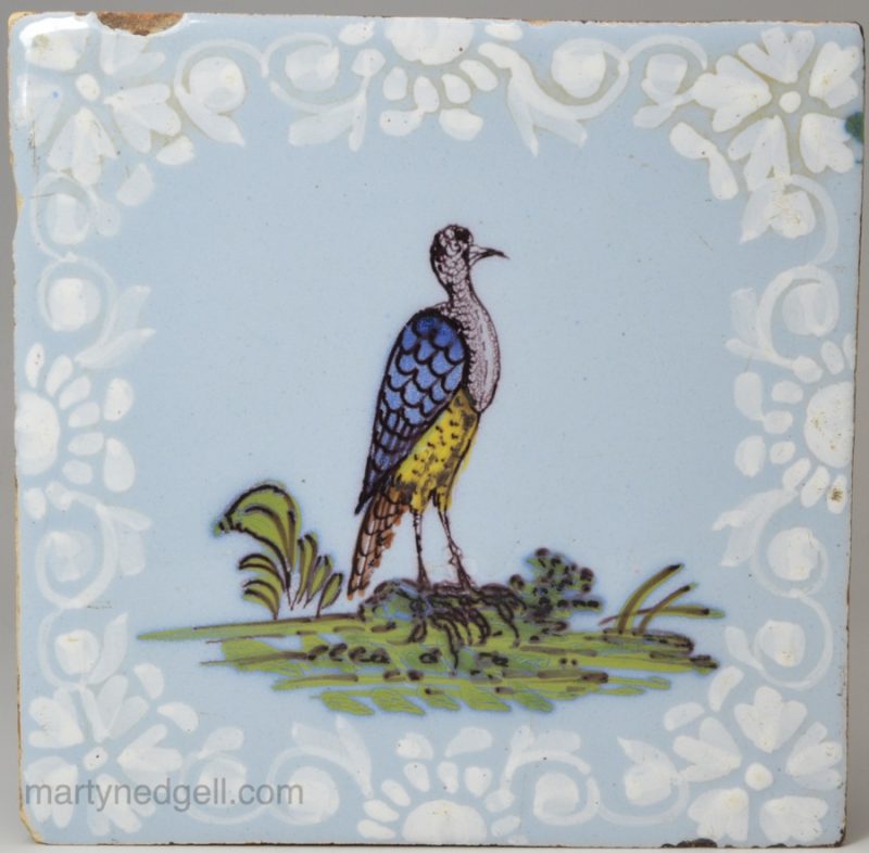 Bristol delft tile, decorated with a fazackerly styled bird and bianco sopra bianco borders, circa 1750