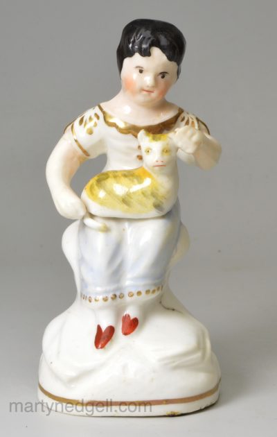 Staffordshire porcelain figure of a girl and her pet cat, circa 1840