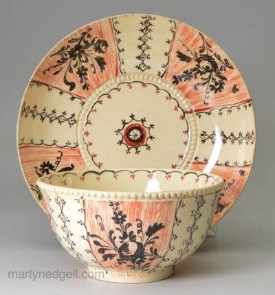 Creamware pottery 'Chintz' tea bowl and saucer, circa 1770