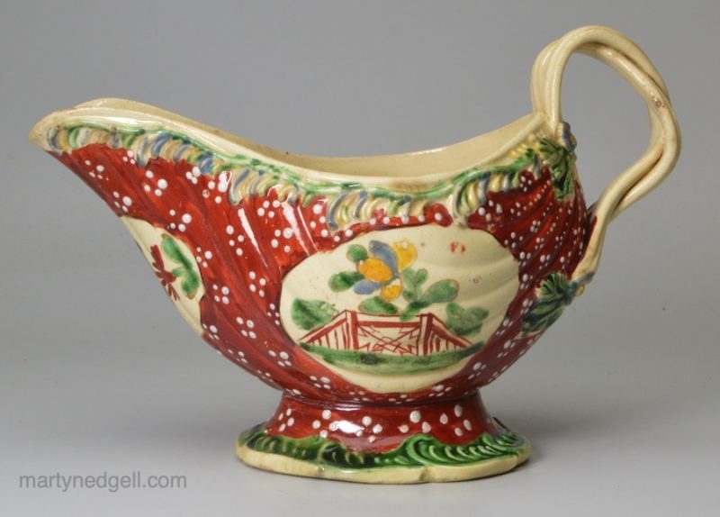 Creamware pottery sauce boat decorated with enamels over the glaze, circa 1770