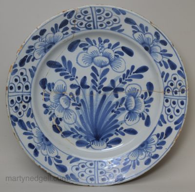 Damaged London delft charger, circa 1740