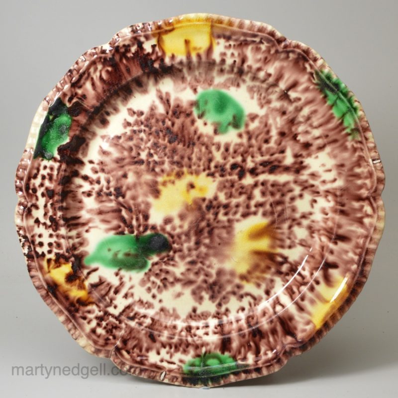 Creamware pottery plate decorated with Whieldon type colours under the glaze, circa 1770