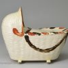 Bovey Tracey creamware pottery model of a cradle with a young child, circa 1800