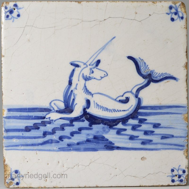 Dutch Delft tile painted in blue with a unicorn fish, circa 1700