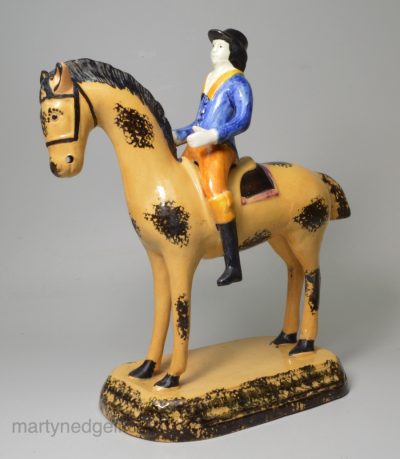 Yorkshire type prattware pottery horse and rider, circa 1820