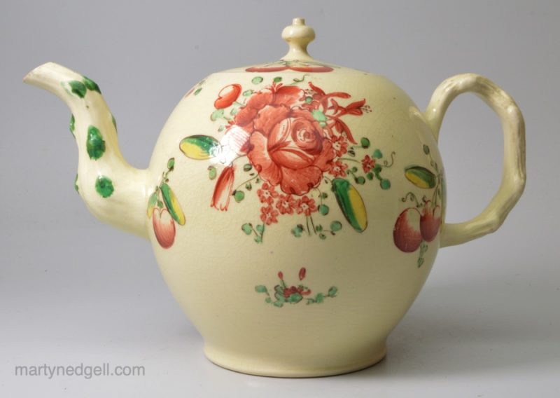 Creamware pottery teapot decorated with enamels over the glaze, circa 1770