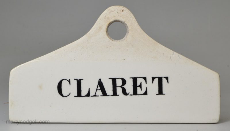 White terracotta partially glazed bin label 'CLARET', circa 1860, impressed W & J Burrow, London & Malvern