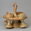 English brown saltglaze egg cup stand and four egg cups, circa 1840 Brampton Pottery