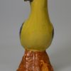 Pearlware pottery model of a parrot decorated with enamels under the glaze, circa 1800