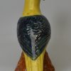 Pearlware pottery model of a parrot decorated with enamels under the glaze, circa 1800