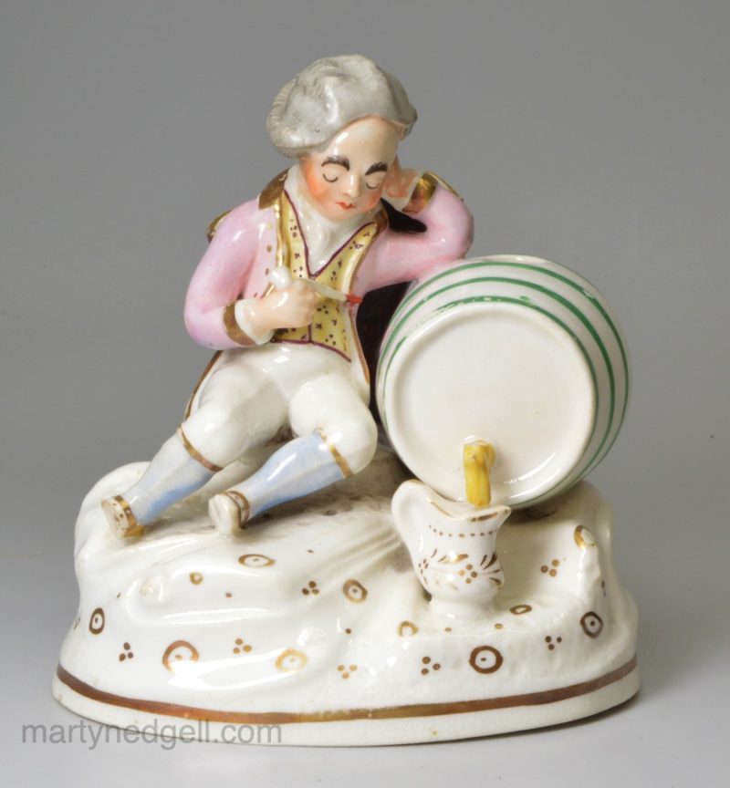 Prattware pottery spirit flask, moulded with classical themes, circa 1800