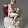 Prattware pottery spirit flask, moulded with classical themes, circa 1800