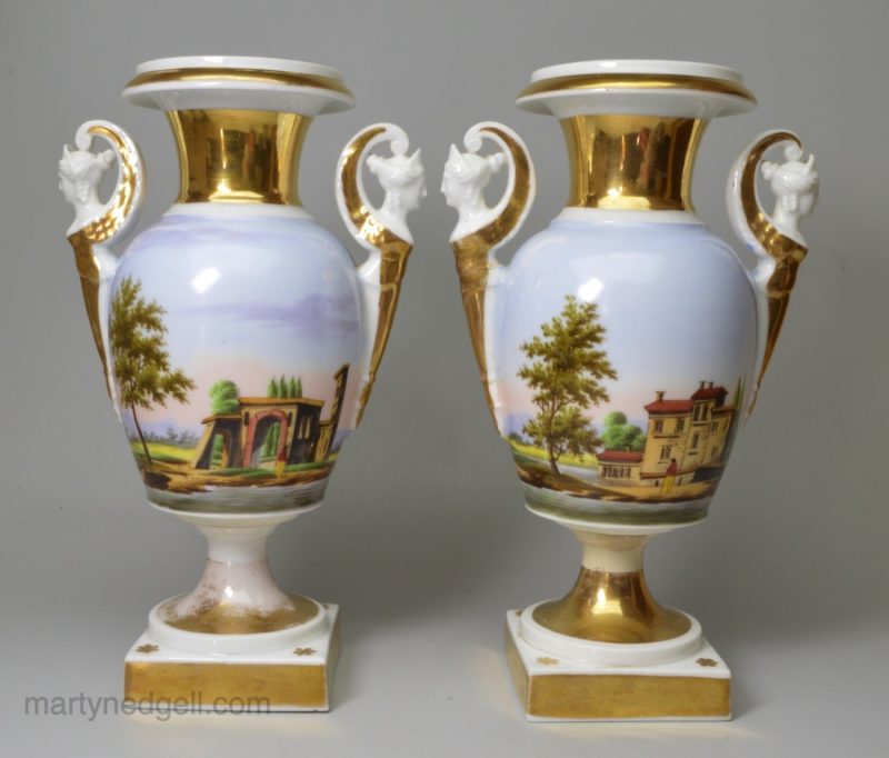 A pair of French porcelain hand painted vases, circa 1870