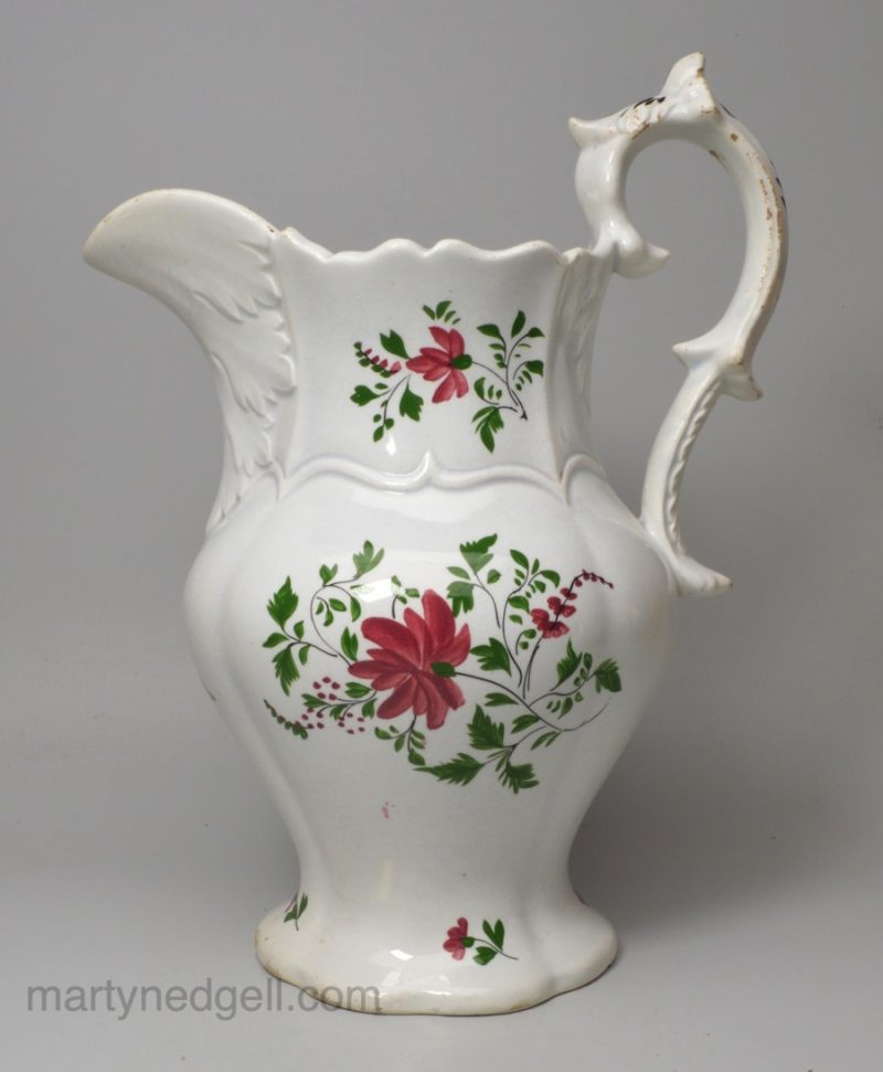 Pearlware pottery serving jug decorated with colours under the glaze, circa 1840