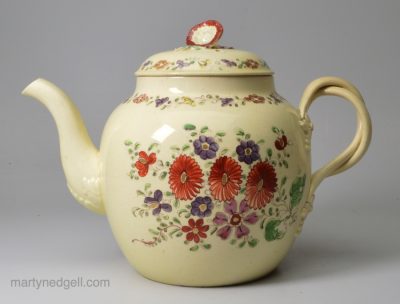 Creamware teapot decorated with enamels and gilding over the glaze, circa 1770