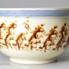 Pearlware pottery handled bowl with sponge decoration under the glaze, circa 1810