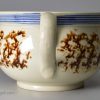 Pearlware pottery handled bowl with sponge decoration under the glaze, circa 1810