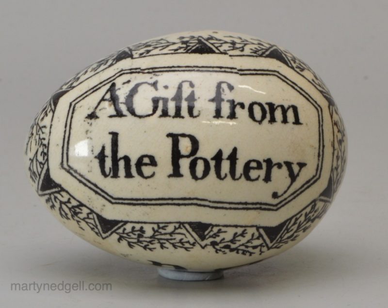 Pearlware pottery darning egg 'A Gift from the Pottery', 'A Reward for Innocence and Truth', circa 1830, possibly Whitehaven Pottery