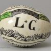 Pearlware pottery darning egg 'A Gift from the Pottery', 'A Reward for Innocence and Truth', circa 1830, possibly Whitehaven Pottery