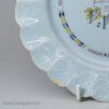 Bristol delft polychrome plate with a pine cone bianco sopra bianco border, circa 1750