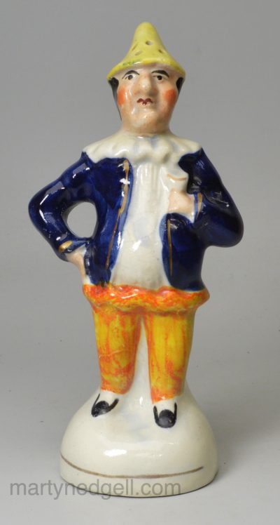 Staffordshire pottery figural pepper pot of Mr Punch, circa 1860