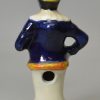 Staffordshire pottery figural pepper pot of Mr Punch, circa 1860