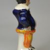 Staffordshire pottery figural pepper pot of Mr Punch, circa 1860