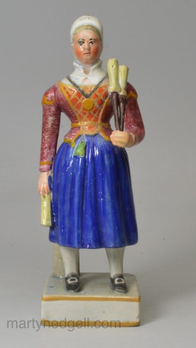 Staffordshire pearlware pottery figure of Madam Vestris playing the Broom Girl, circa 1820