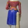 Staffordshire pearlware pottery figure of Madam Vestris playing the Broom Girl, circa 1820