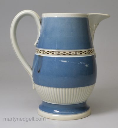 Pearlware pottery jug decorated with blue slip and brown inlay, circa 1800