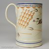 Prattware pottery farmer's mug decorated with enamels under the glaze, circa 1820