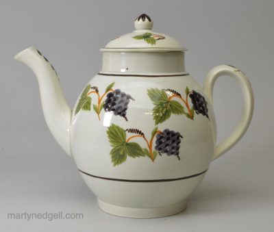 Prattware pottery teapot decorated with colours under the glaze, circa 1820