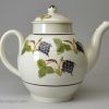 Prattware pottery teapot decorated with colours under the glaze, circa 1820