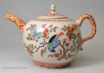 Staffordshire white saltglaze teapot decorated with enamels, circa 1750