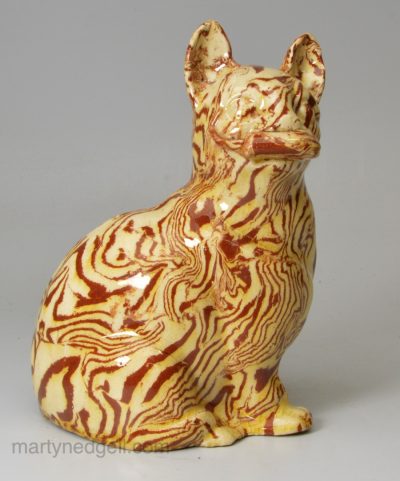 Staffordshire agateware cat with a mouse in it's mouth, circa 1770