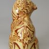 Staffordshire agateware cat with a mouse in it's mouth, circa 1770