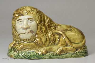 Pearlware pottery lion decorated with colours under the glaze, circa 1800