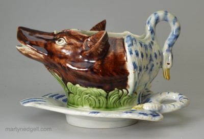 Pearlware pottery fox and goose sauce boat and stand, circa 1790