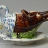 Pearlware pottery fox and goose sauce boat and stand, circa 1790